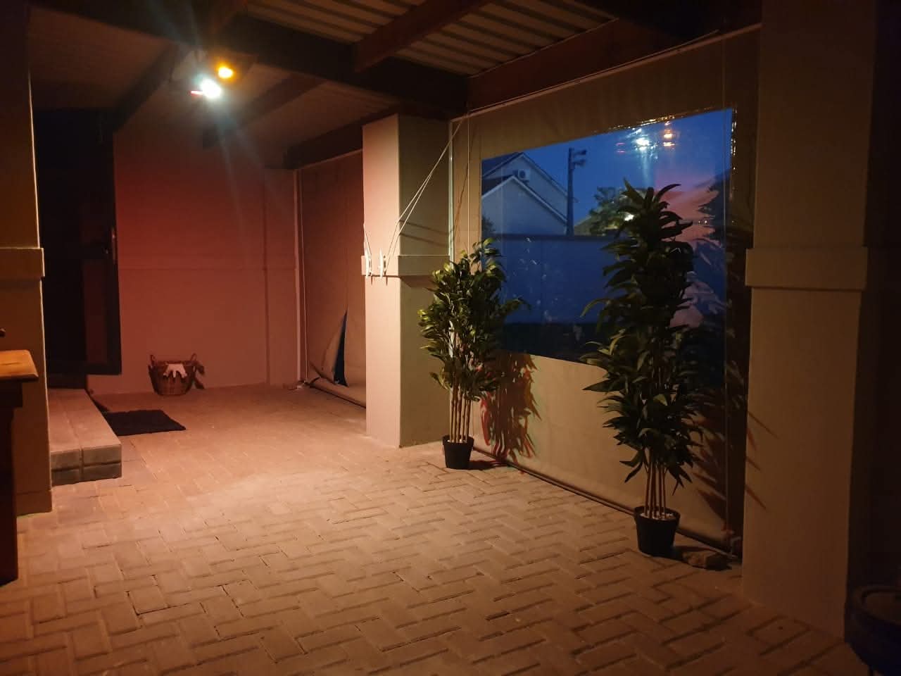 Durable outdoor blinds providing shade for a patio area.